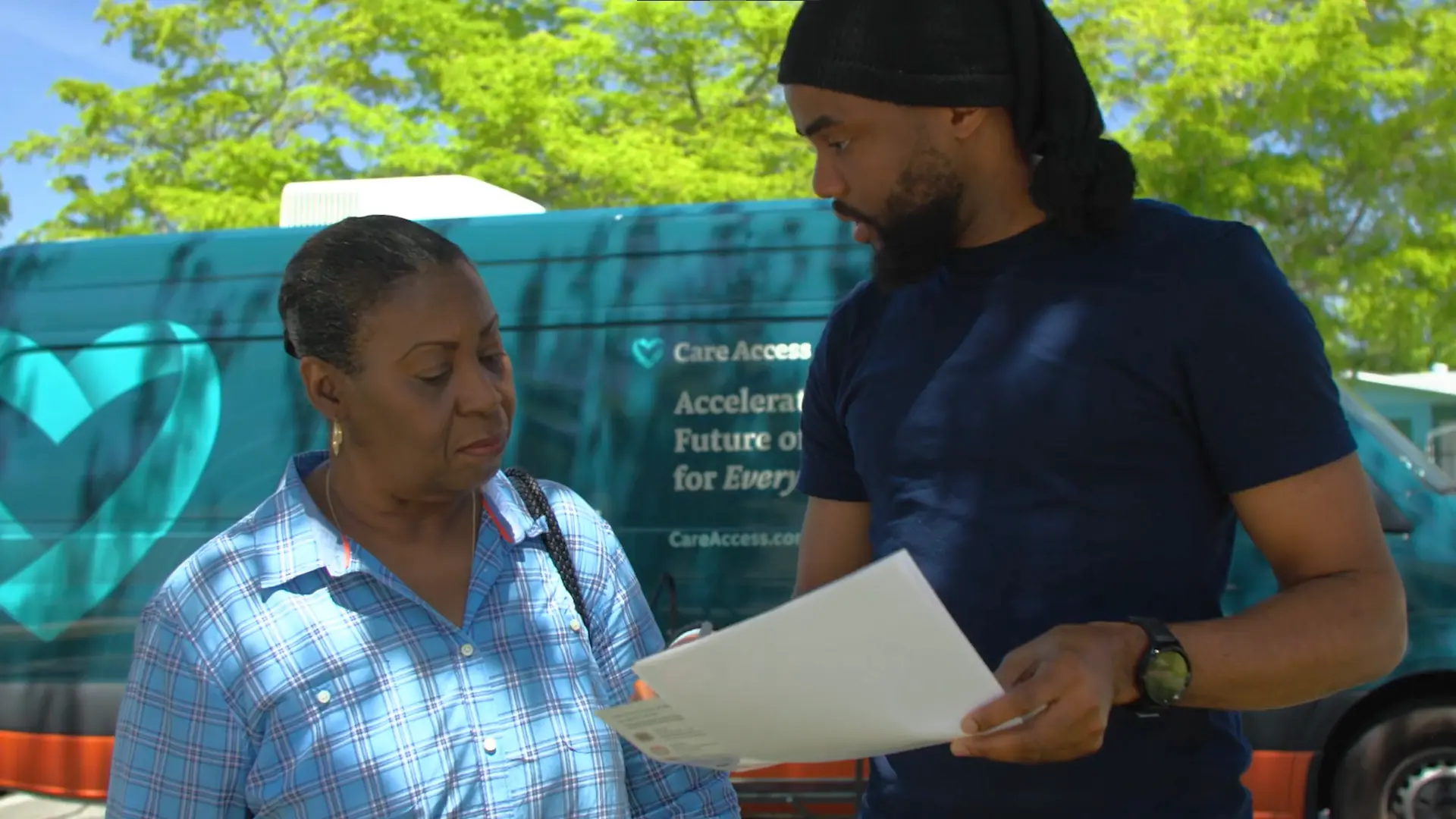 young man assisting elderly woman